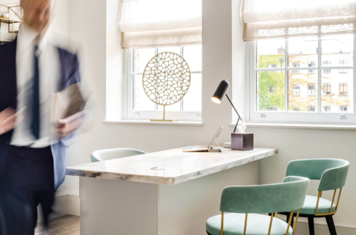 Consulting room interior showing a desk and two chairs at the Fertility Clinic